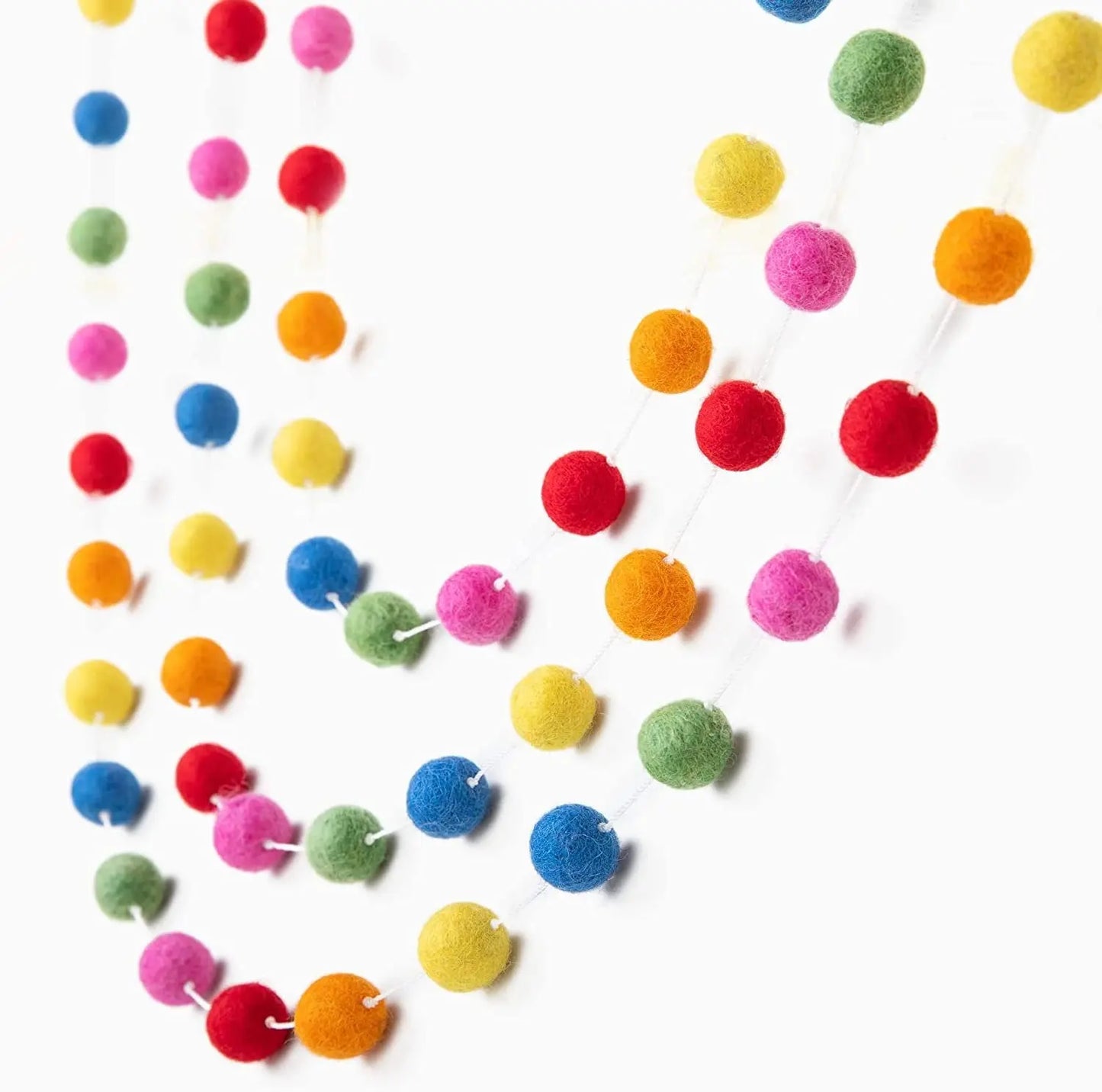 A playful garland strung with large, fluffy felt balls.