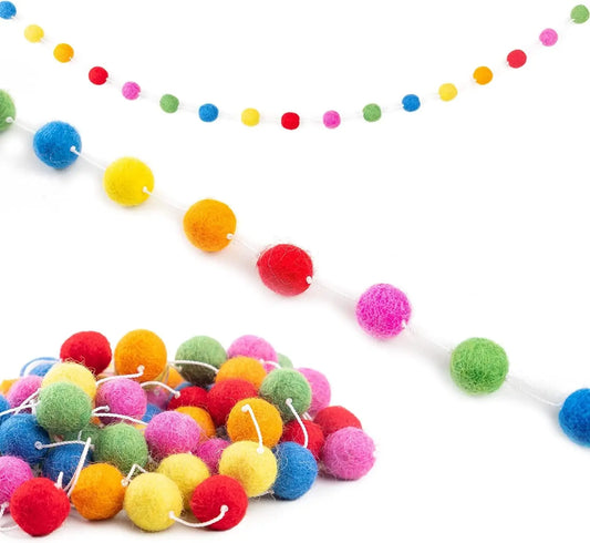 A playful garland strung with large, fluffy felt balls.