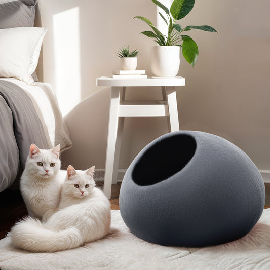 Handcrafted felted wool cat cave in warm earth tones, perfect for cozy cat naps. Circular design with a wide entrance for easy access. Soft and plush interior for comfort, providing a safe retreat for your feline friend. Ideal for cats of all sizes